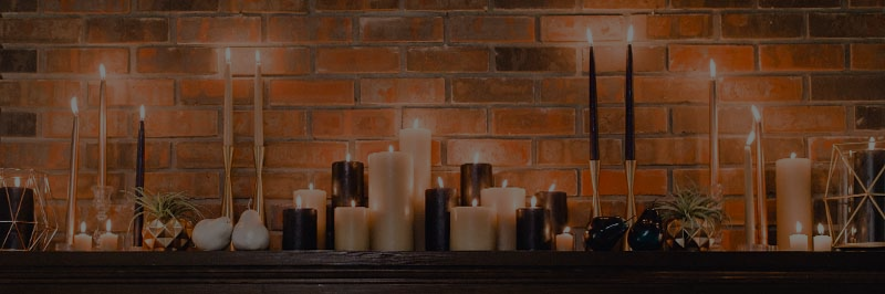 candle display on fireplace mantel