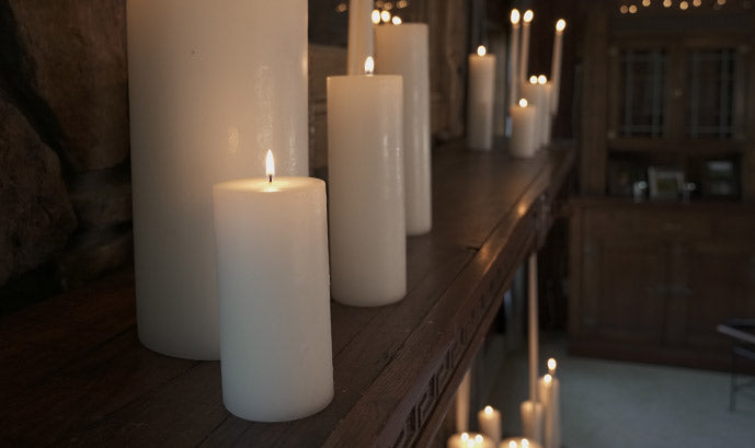 pillar candles on a mantle
