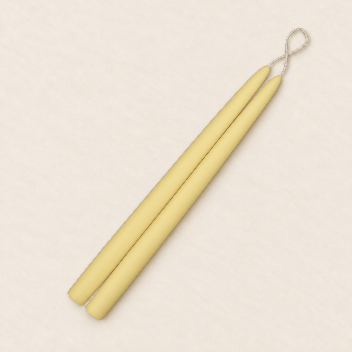 A pair of 12 inch Beeswax Natural taper candles, hand-dipped by Creative Candles