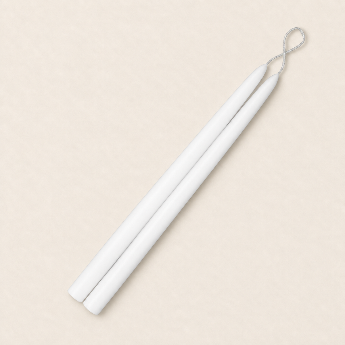 A pair of 12 inch White taper candles, hand-dipped by Creative Candles
