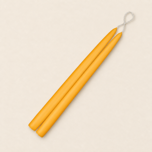 A pair of 12 inch Saffron taper candles, hand-dipped by Creative Candles