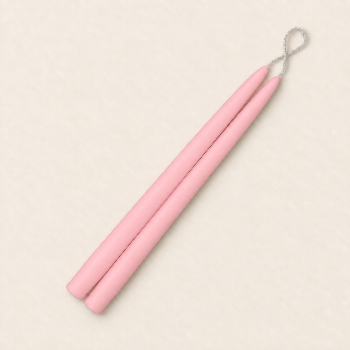 A pair of 12 inch Petal Pink taper candles, hand-dipped by Creative Candles