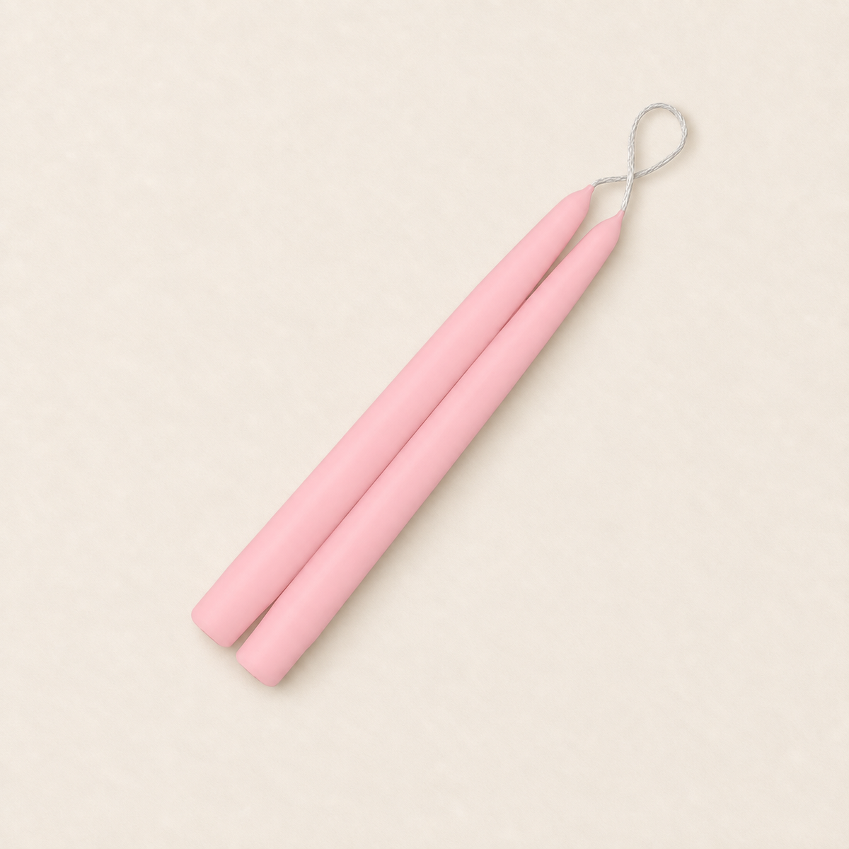 A pair of 9 inch Petal Pink taper candles, hand-dipped by Creative Candles
