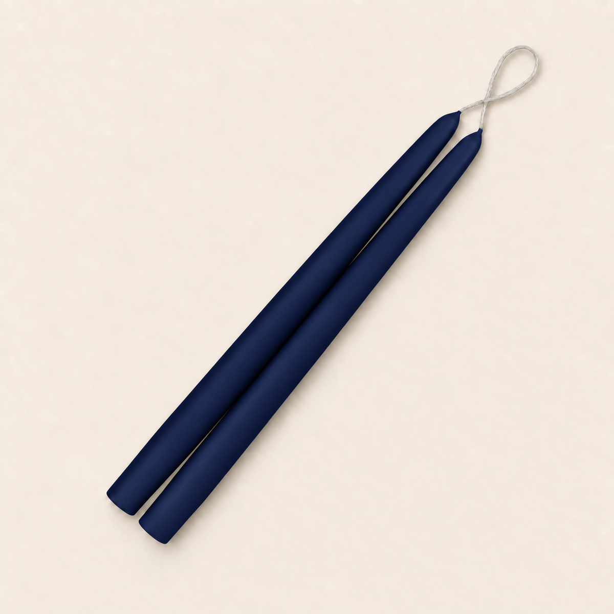 A pair of 12 inch Navy Blue taper candles, hand-dipped by Creative Candles