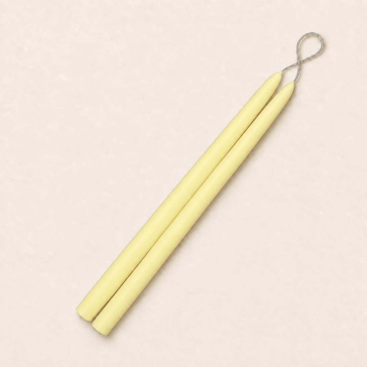 A pair of 12 inch Lemon Chiffon taper candles, hand-dipped by Creative Candles
