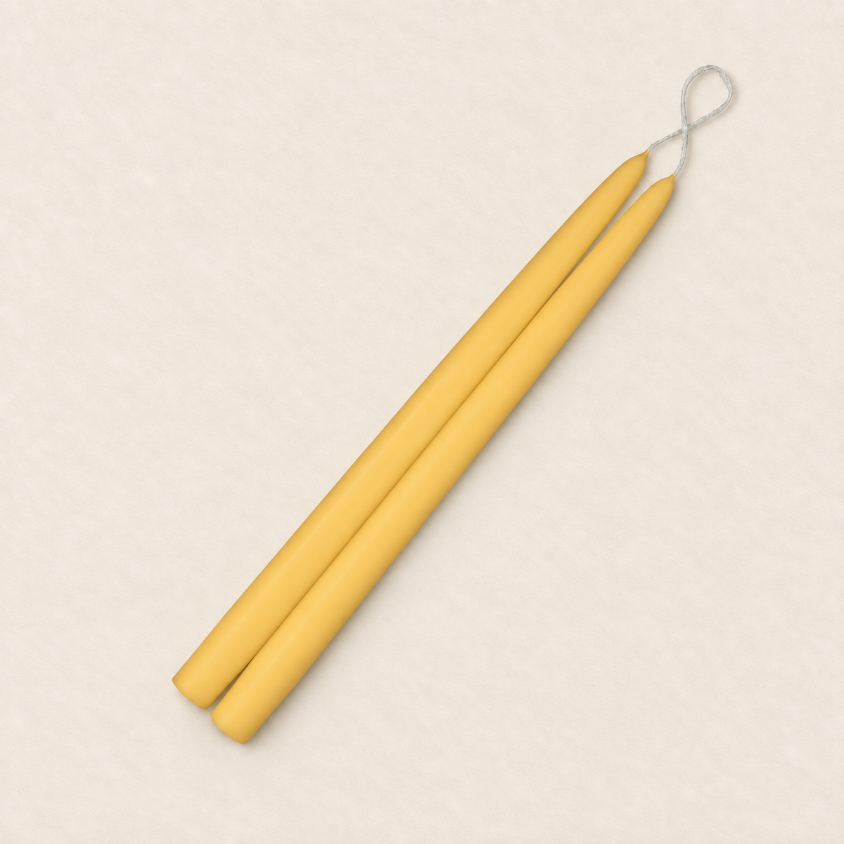 A pair of 12 inch Honeysuckle taper candles, hand-dipped by Creative Candles