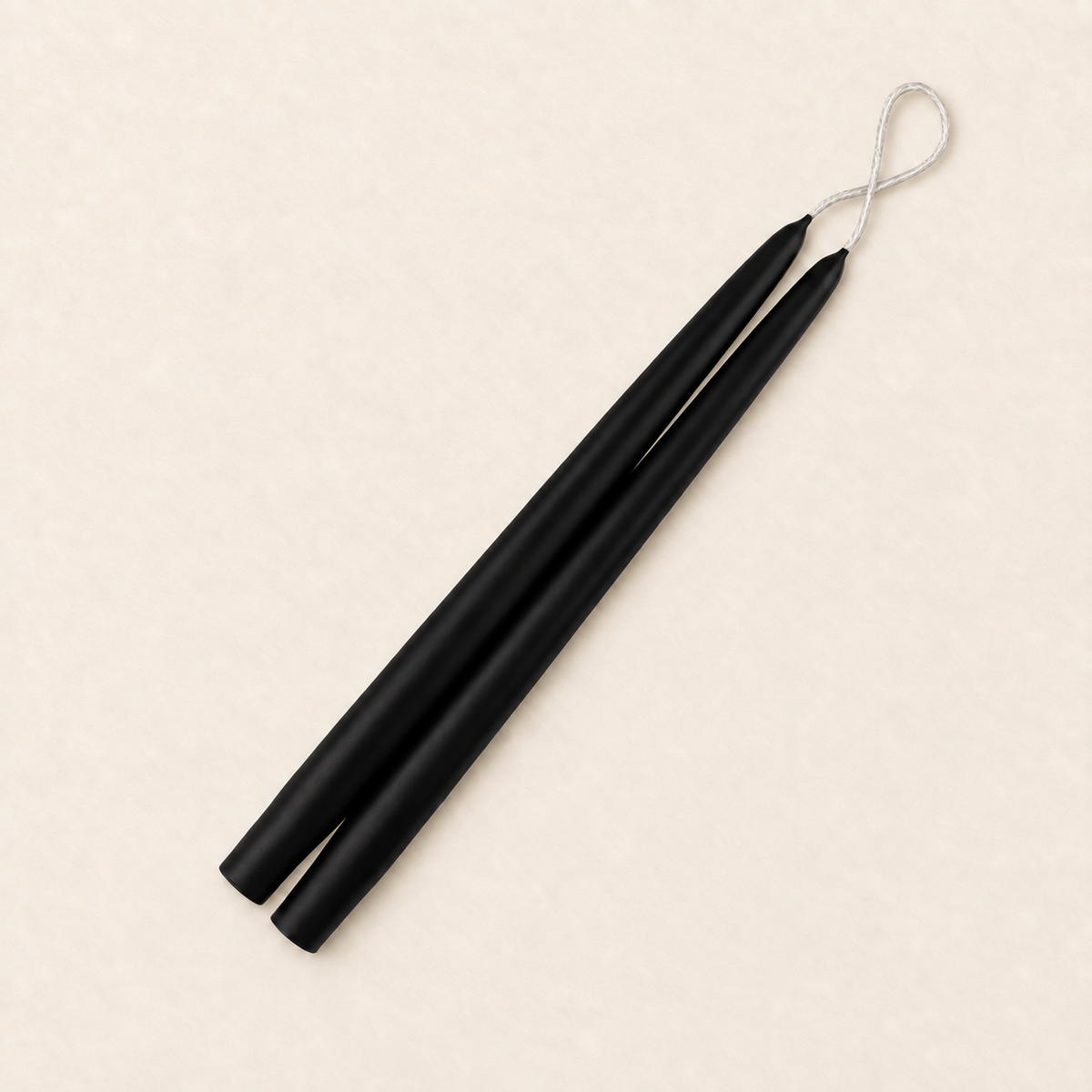 A pair of 12 inch Black taper candles, hand-dipped by Creative Candles