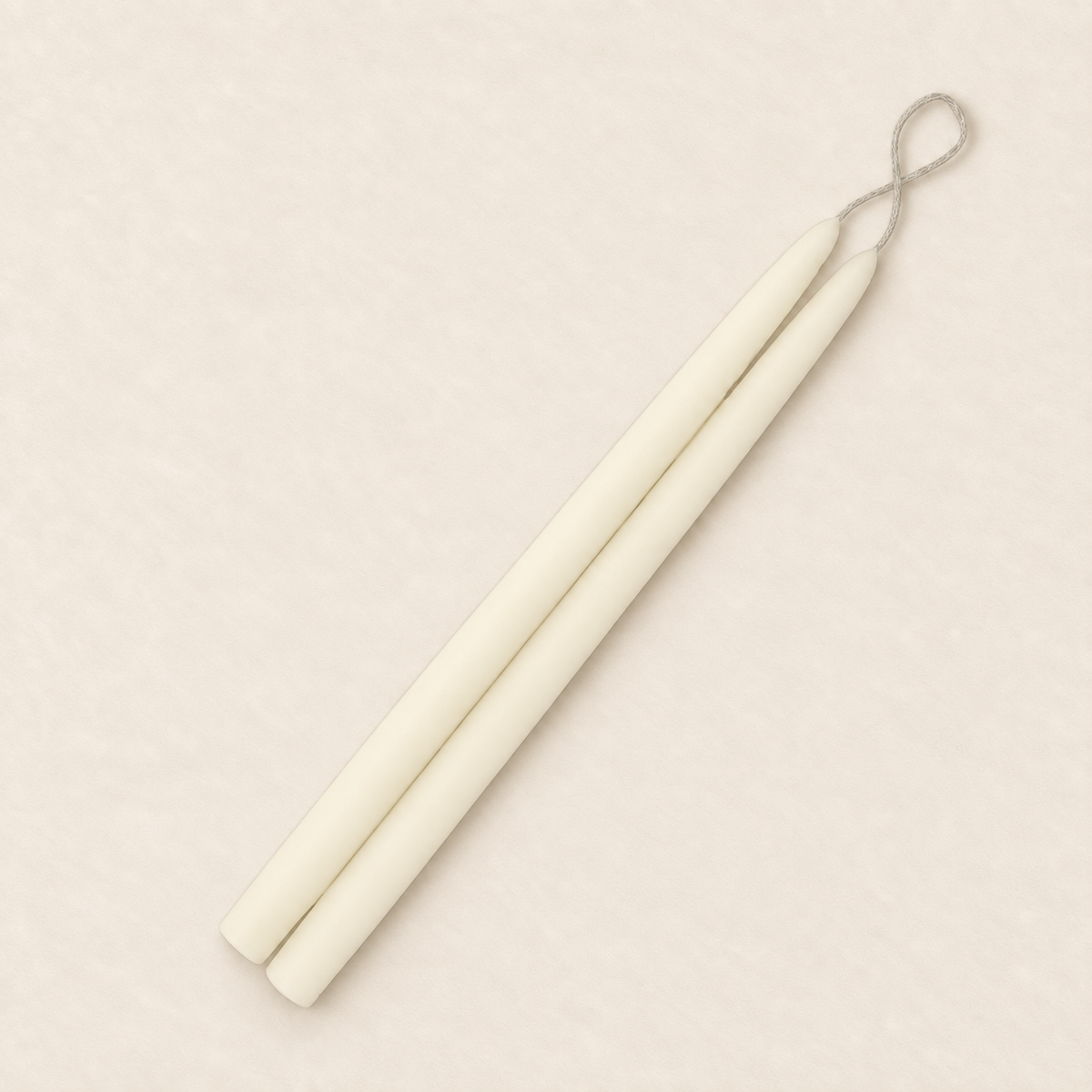 A pair of 12 inch Ivory taper candles, hand-dipped by Creative Candles