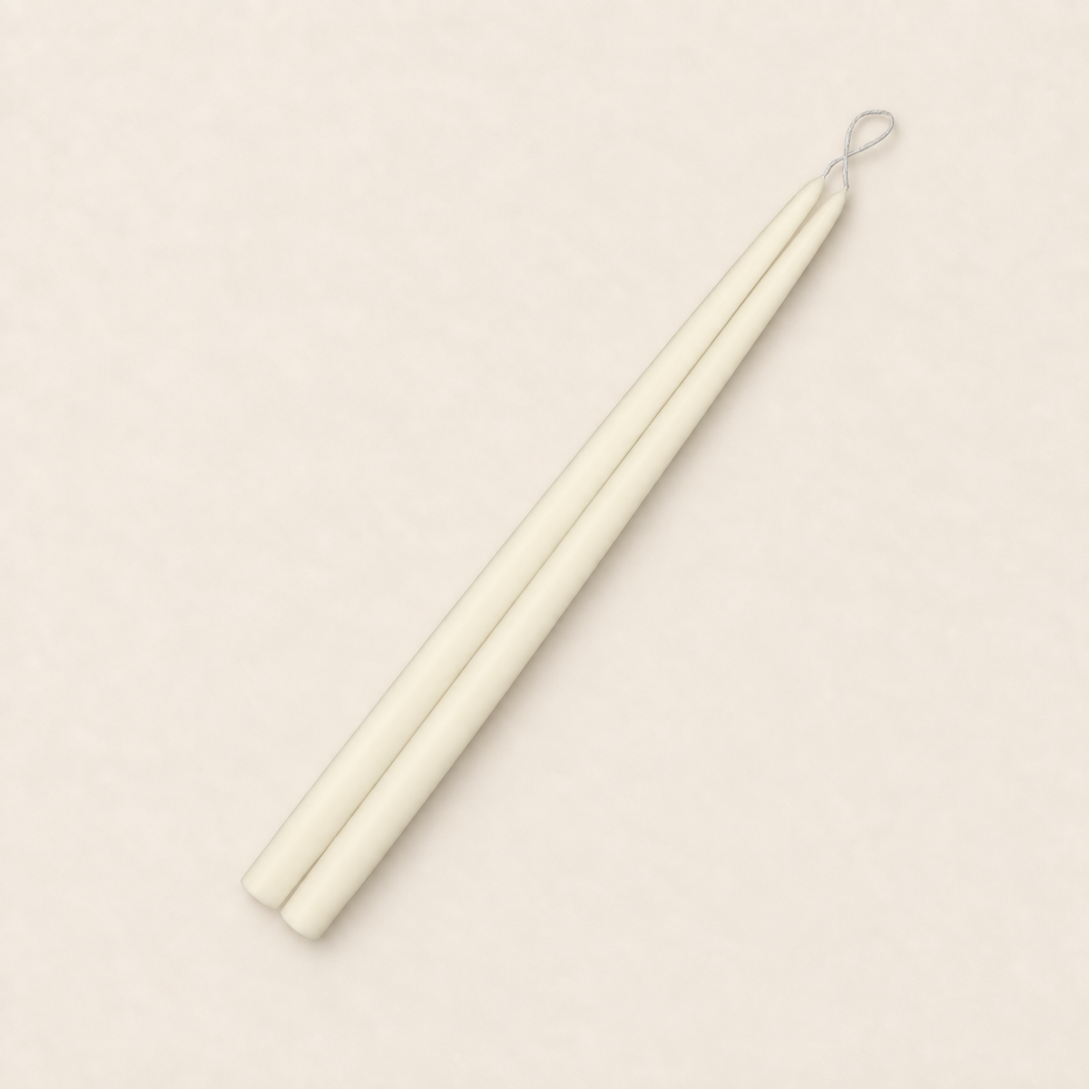 A pair of 15 inch Ivory taper candles, hand-dipped by Creative Candles