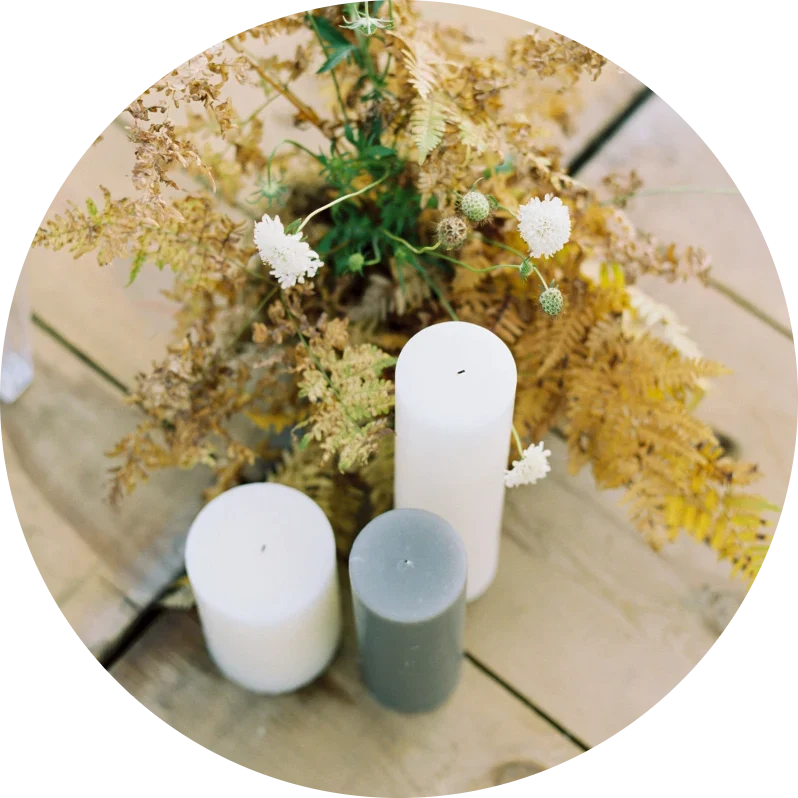 Pair pillar candles with foliage