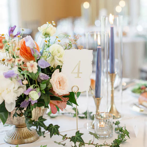 Cornflower Taper Candles in hurricane glass on decorated table